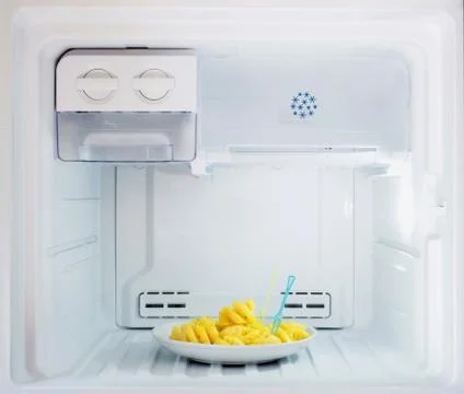 Diet fruit, pineapple dish put in freezer fridge Stock Photos