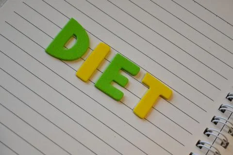 Diet lettering on a lined notebook Stock Photos