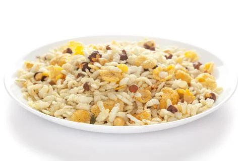 Diet Lite Mixture in white ceramic plate. Puffed Rice, Corn Flakes, Curry leaves Stock Photos
