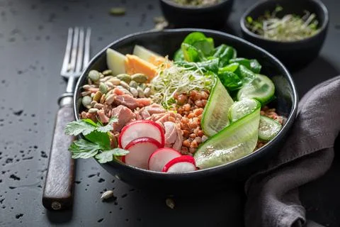 Diet Nicoise salad with eggs, groats and tuna. Stock Photos