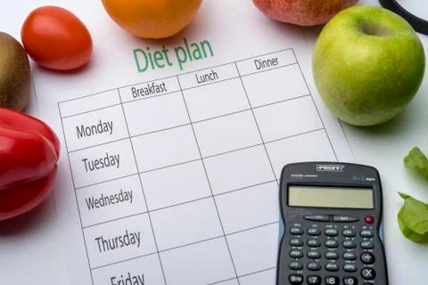 Diet plan sheet and fresh food on white background. Foto stock