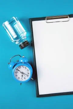 The diet plan. White sheet on the tablet among the bottles with water and app Stock Photos