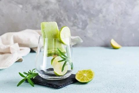 Diet popsicle made from avocado and lime in a glass on the table. Homemade .. Stock Photos