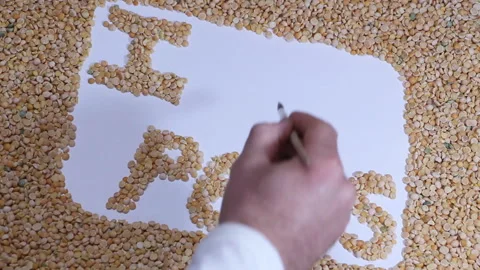 Diet. On the table with peas a man wrote I like peas Stock Footage 88449113