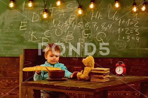 Dieting and diet. Dieting, little boy eat french baguette at table. Healthy Stock Photos