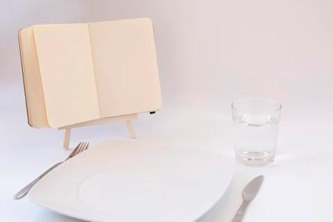 Diets concept. Open notebook on the table Stock Photos