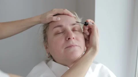 The difference before and after when coloring eyebrows. Eyebrow coloring Stock Footage 222906652