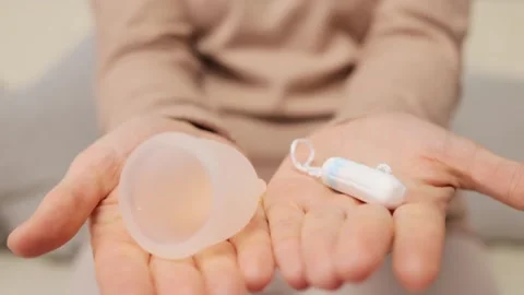 Difference between cup and tampon. Safe and ecological menstrual choice. Health Stock Footage 257056436