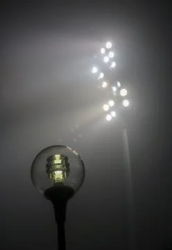 Difference between dim streetlight and bright floodlights at night, Finland 写真素材
