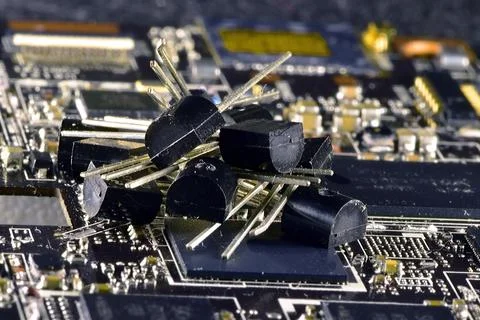 The difference in the size of transistors in a plastic TO92 case and uncased  Stock Photos