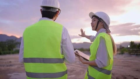 Different age colleagues work together on construction site, training new stuff Stock Footage 157067258