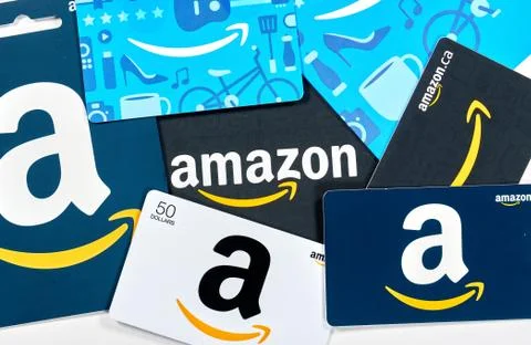 Different Amazon gift cards. Amazon is a titan of e-commerce, logistics, paym Stock Photos