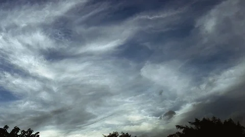 Different and weird cloud patterns during early morning sky from a bus window Stock Footage 85597738