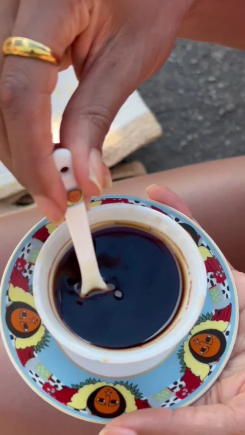 Different angles of a Black person stirring coffee Vídeo Stock 289871377