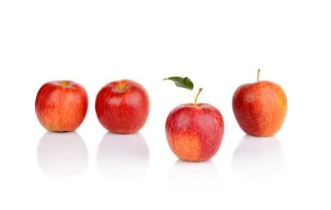 Different apple rare stand out from the crowd in line on a white background Stock Photos
