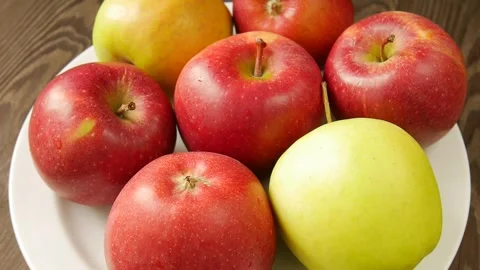 Different apples on a plate. Stock Footage 297097798