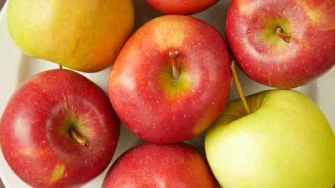 Different apples on a plate. Stock Footage 297299500