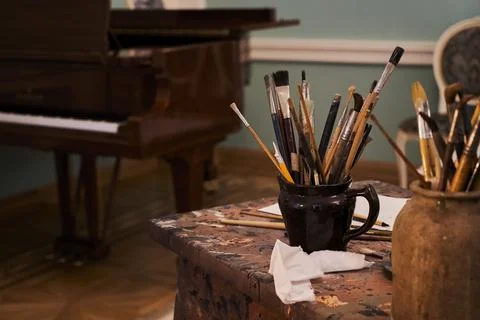 Different artist's accessories on table with background Stock Photos