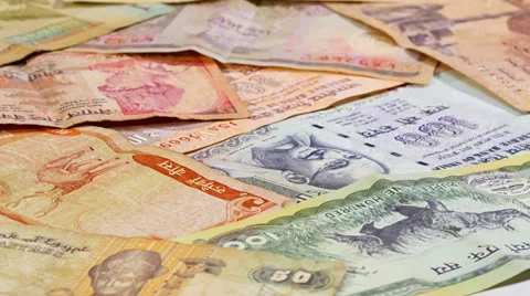 Different asian currency bank notes rotating business background Video stock 60857793