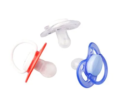 Different  baby dummies isolated over white Foto stock