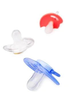 Different baby dummies isolated Stock Photos