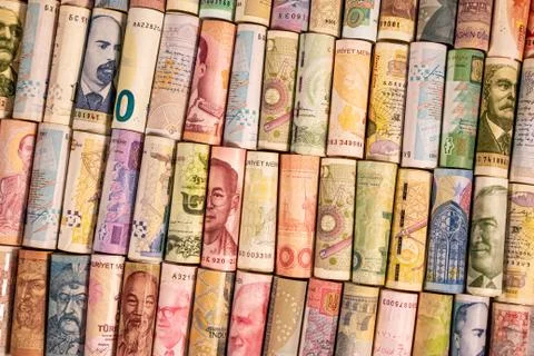 Different banknotes from various countries on rolls Stock Photos