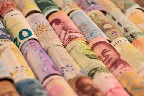Different banknotes from various countries on rolls Stock Photos