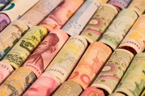 Different banknotes from various countries on rolls Stock Photos