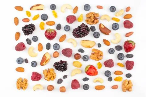 Different berries and nuts on a white background. vitamin proteins and health Stock Photos