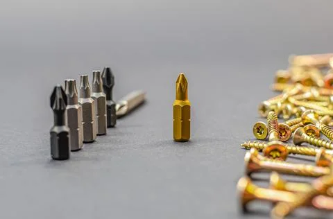 Different bits are installed in a row, nozzles for electric drills for tighte Stock Photos