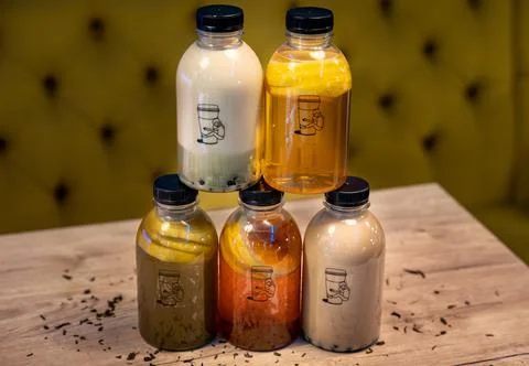 Different bottles of Chinese tea, bubble tea, lemon tea, coffee bubble tea an Stock Photos