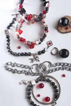 Different   bracelets with black and red  semipreciouse stones with natural.. Stock Photos