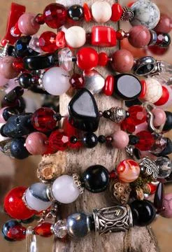 Different   bracelets with black and red  semipreciouse stones with natural.. Stock Photos
