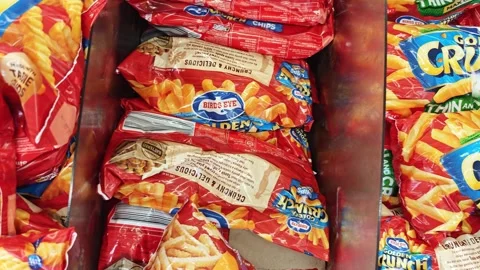 Different brands of Snap Frozen Potato Fries in plastic packaging Stock Footage 322863202