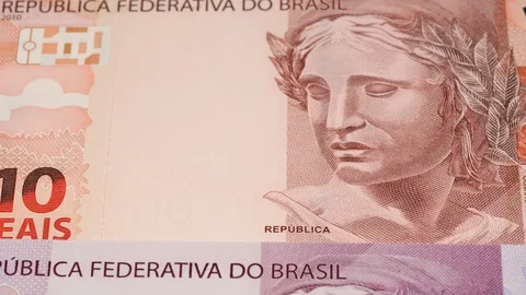 Different Brazil real notes tracking. Slider shot. Low angle, macro. 4K Stock Footage 125338564