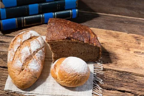 Different bread rye round baguette isolated on wood Stock Photos