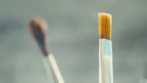 Different brushes for drawing on grey background. Stock Footage 103451230
