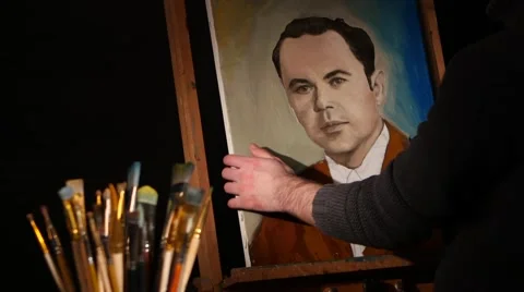 Different brushes, rotation, with easel and painting man in brown jacket Stock Footage 49712685
