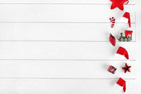 Different christmas objects lay out on white wooden background 스톡 사진