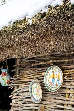 Different clay dishes tableware, plate, jars, souvenirs on straw rural old ho Stock Photos