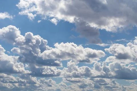 Different clouds in a blue sky Stock Photos
