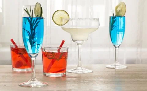 Different cocktails in front of window Stock Photos