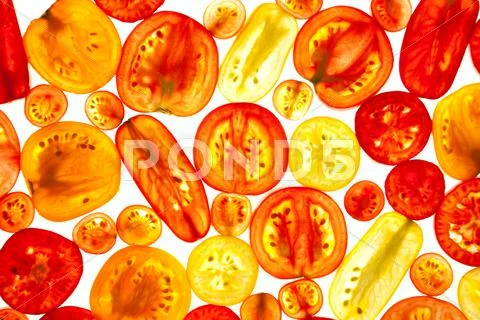Different color and shapes of tomatoes slices Stock Photos
