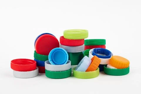 Different color bottle caps, material for recycling. Stock Photos