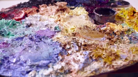 Different color paint on the palette closeup Stock Footage 74720194