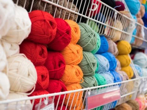 Different color threads on rows in the store Stock Photos