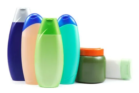 Different color tubes and bottles for hygiene, health and beauty on a white b Stock Photos