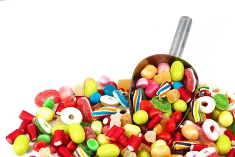 Different colored candies isolated in white background Stock Photos