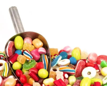 Different colored candies isolated in white background Stock Photos