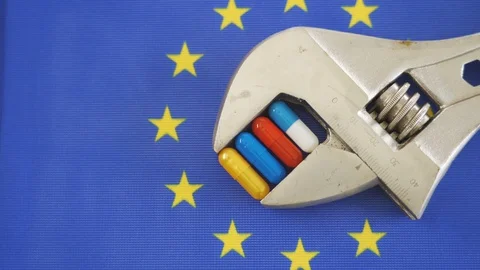 Different colored capsules on the wrench with the EU flag Stock Footage 129338251